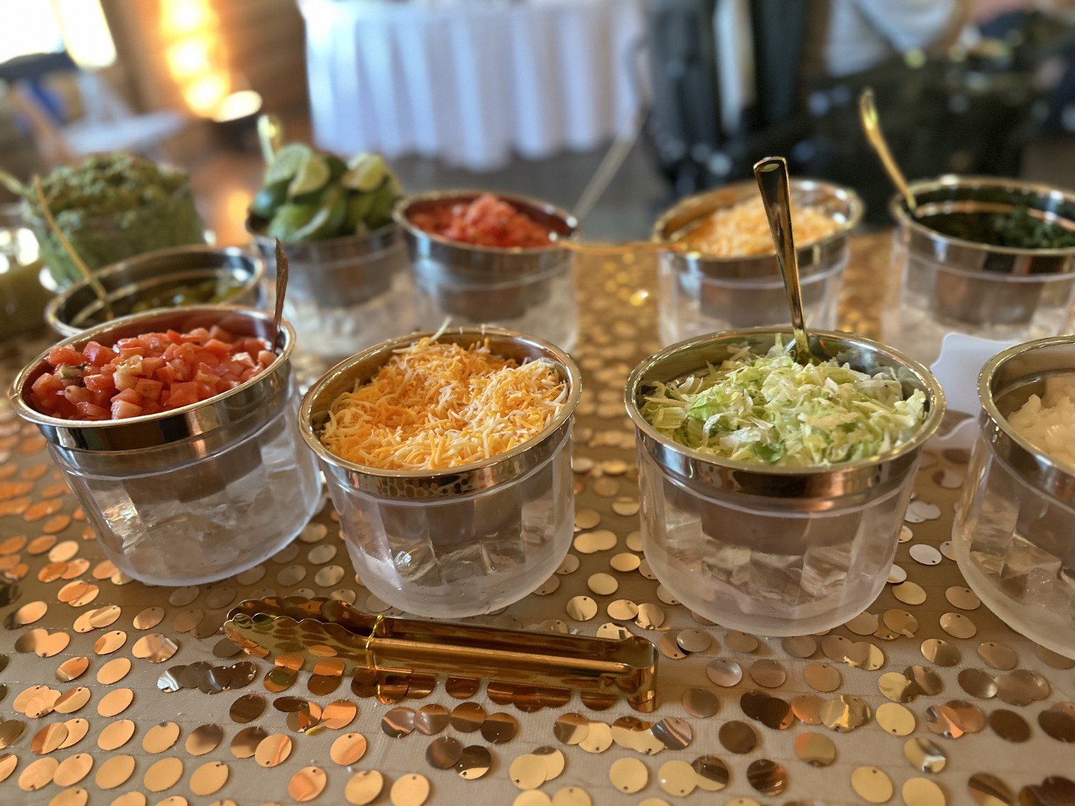 Fresh toppings prepared for a Paco's taco bar
